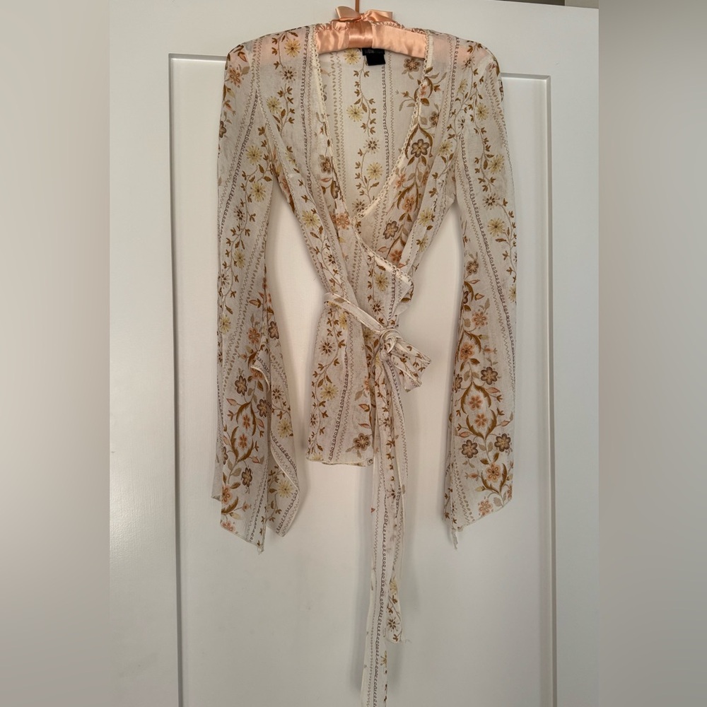 To the Max Cream Floral Wrap Top